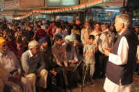 Addressing public meeting at Village Burail